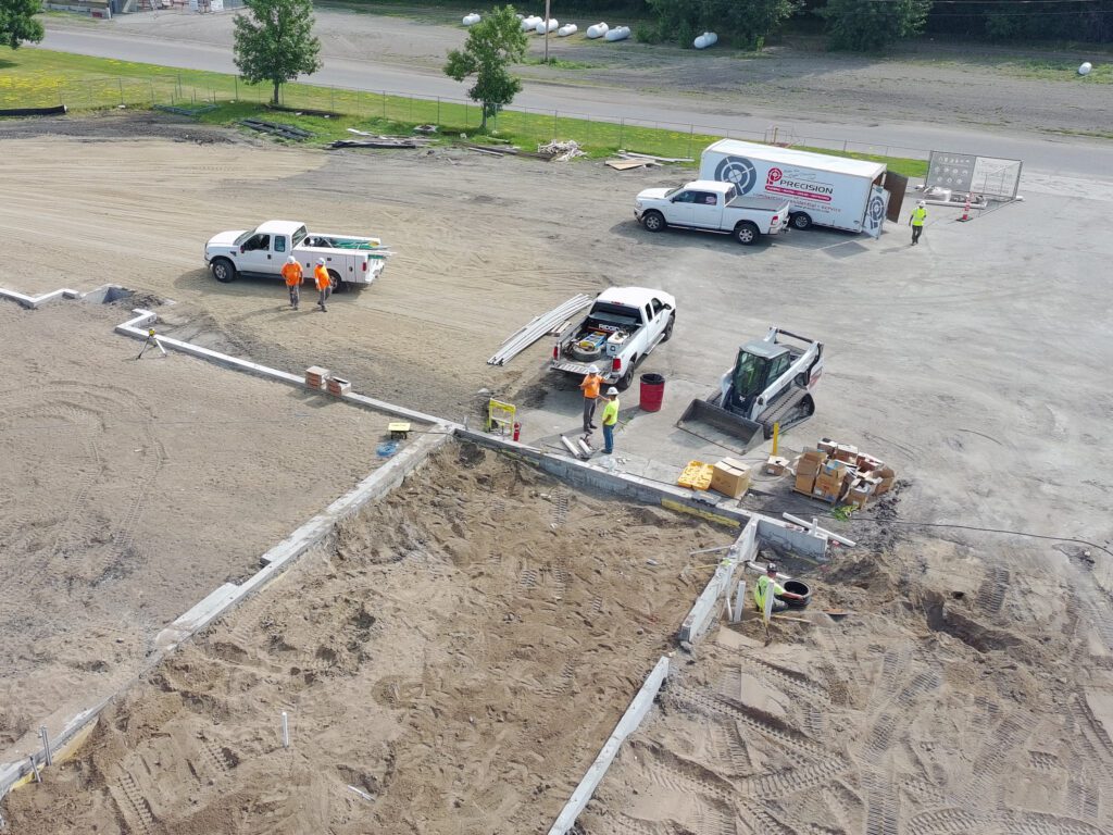 Crews unload material at the Ada Municipal Complex
