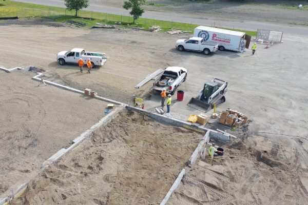 Crews unload material at the Ada Municipal Complex