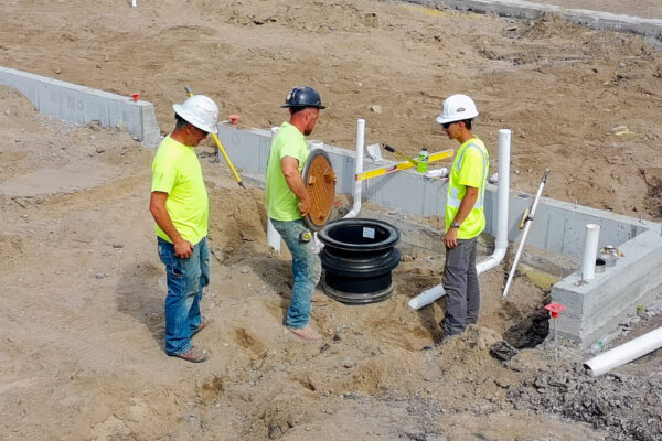 Wayne reviewing a drain basin at the Ada Municipal